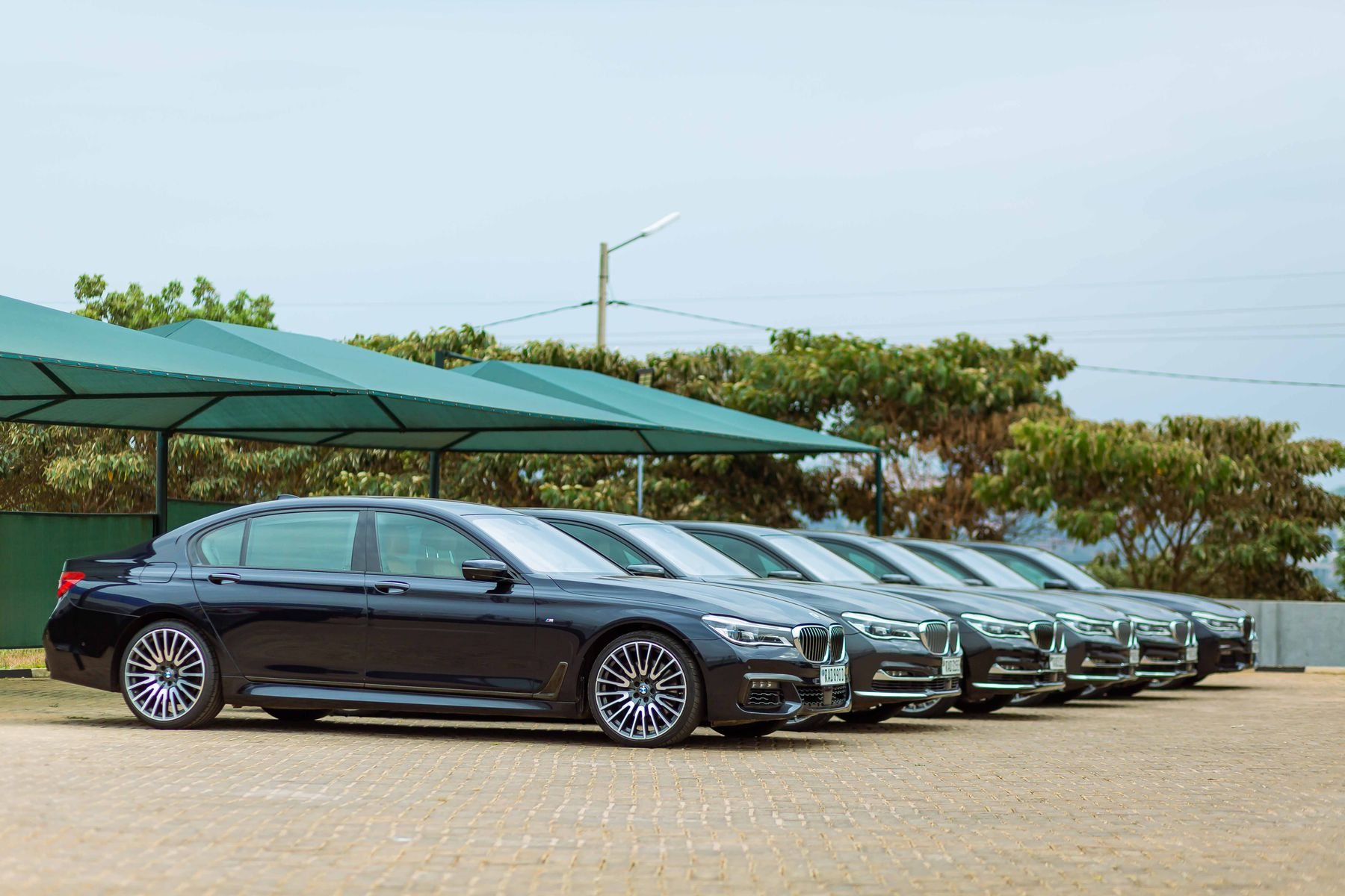 A coordinated line of BMW 7 Series luxury sedans
